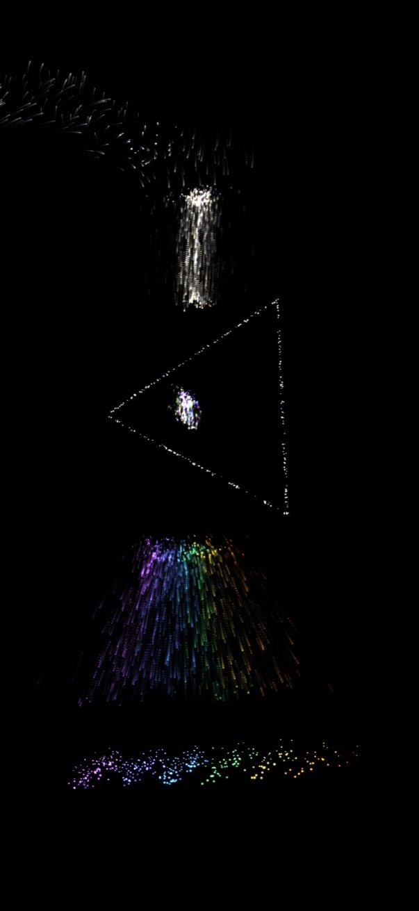 Worddust showing a vertical prism of white particles splitting a column of light into a rainbow
